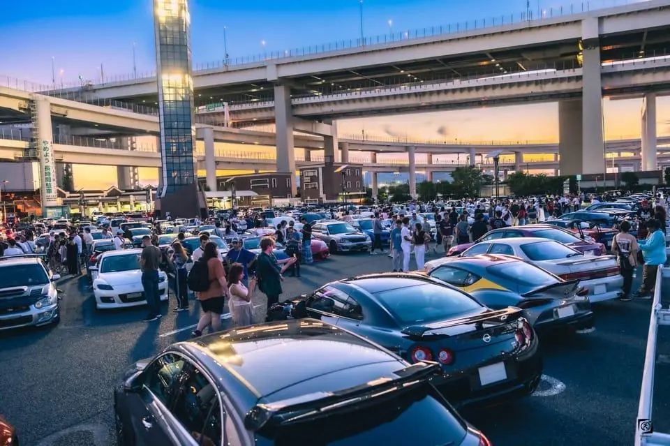 Crowds and modified cars filling Daikoku PA on a busy evening