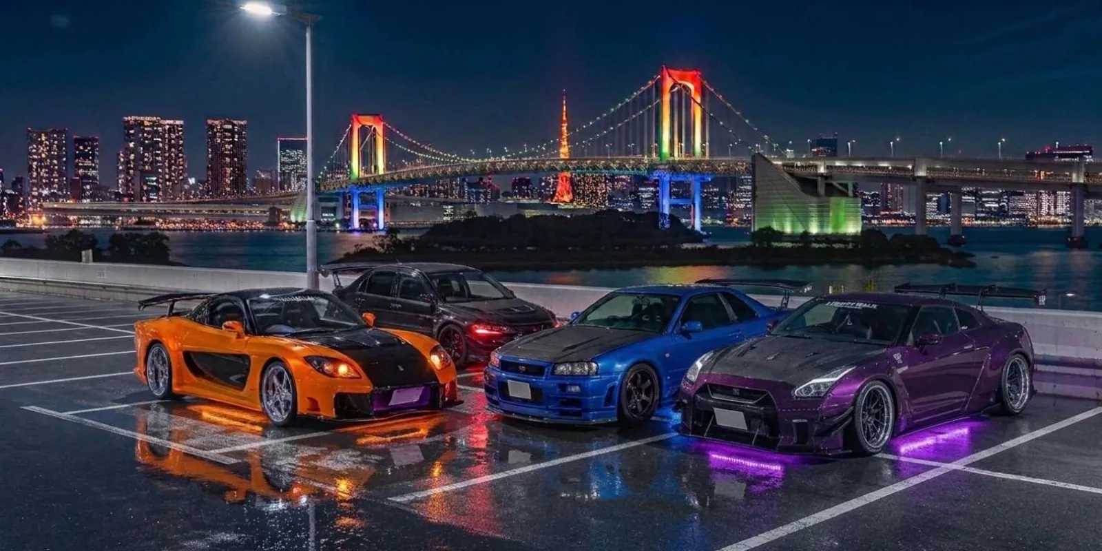Orange, black, blue and purple JDM sports cars lined up with Tokyo's Rainbow Bridge and skyline behind them